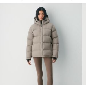 ARITIZIA - TNA - SUPER PUFF JACKET- womans LG. Taupe. New in bag. removable hood
